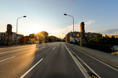 Road in city against clear sky