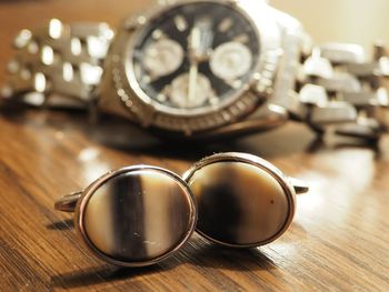 Close-up of clock on table