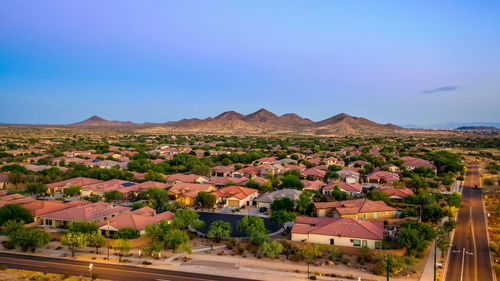 Panoramic view of buildings in city against clear sky