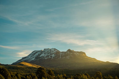 Scenic view of mountains against sky during sunset