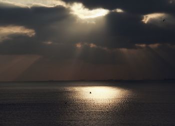 Scenic view of sea against sky at sunset