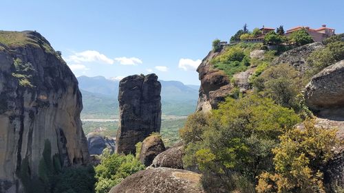 Panoramic view of rocks and plants against sky