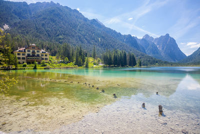 Scenic view of lake against cloudy sky