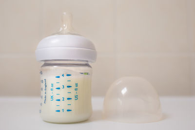 Close-up of milk in bottle on table