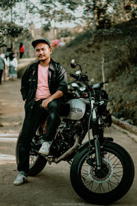 Portrait of young man riding motorcycle