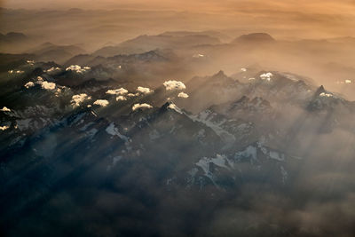 Scenic view of mountains against sky during sunset