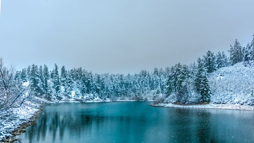 Scenic view of frozen lake against sky during winter