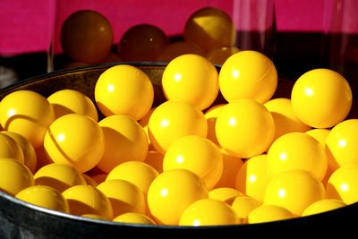 High angle view of yellow balls in container at store