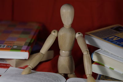 Wooden figurine with books