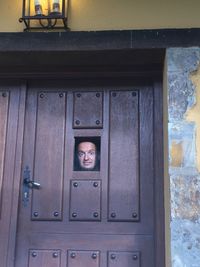 Portrait of man with closed door