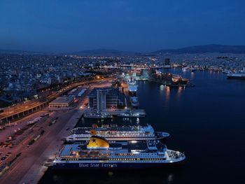 High angle view of illuminated city buildings at night