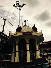 Low angle view of statue against building