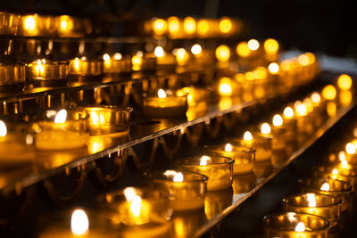 Illuminated candles in temple