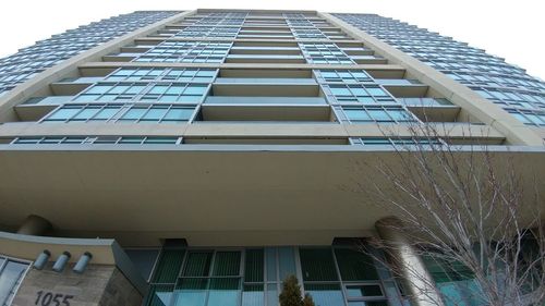 Low angle view of office building against sky