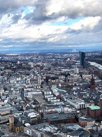High angle view of city against cloudy sky