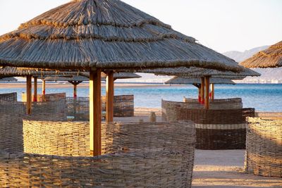 Built structure on beach against clear sky