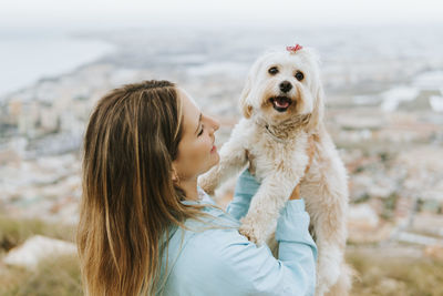 Portrait of woman with dog