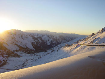 Scenic view of snowcapped mountains against sky