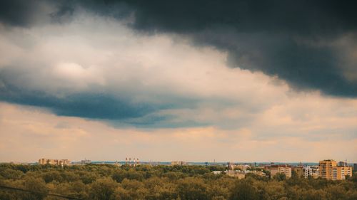 Panoramic view of landscape against cloudy sky