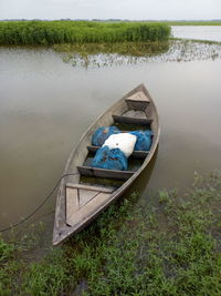 High angle view of boat moored in lake