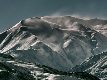 Scenic view of snowcapped mountain against sky