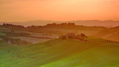 Scenic view of landscape against sky during sunset