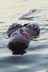 Close-up of seductive woman in lake