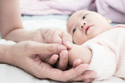 Baby feet of mother and daughter