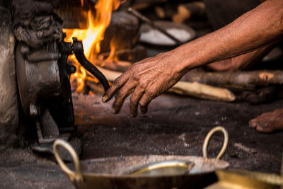 Close-up of blacksmith working at workshop