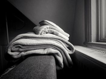 Close-up of woman holding hands at home