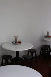 Empty chairs and tables in cafe