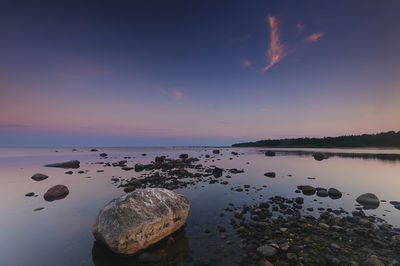 Scenic view of sea against sky at sunset