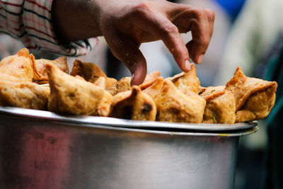 Close-up of man preparing food