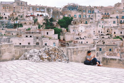 People sitting outside building