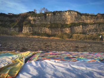 Scenic view of rocks on land against sky