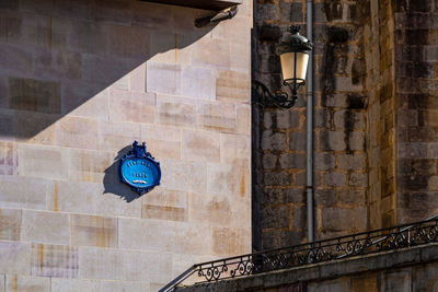 Low angle view of street light against building