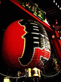 Low angle view of illuminated ferris wheel