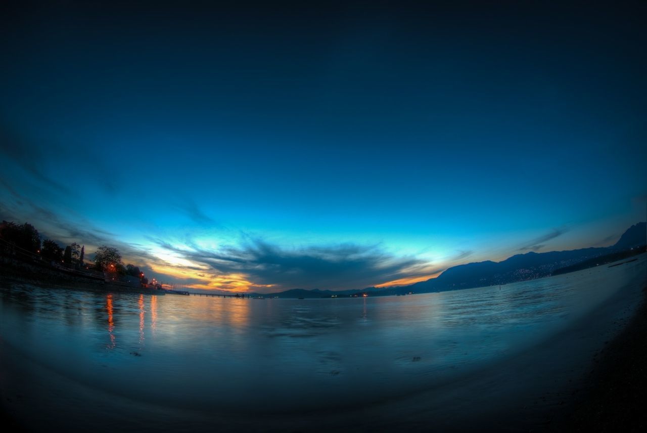 water, tranquil scene, scenics, tranquility, sky, beauty in nature, reflection, nature, lake, sea, sunset, idyllic, cloud - sky, dusk, blue, calm, beach, nautical vessel, waterfront, shore