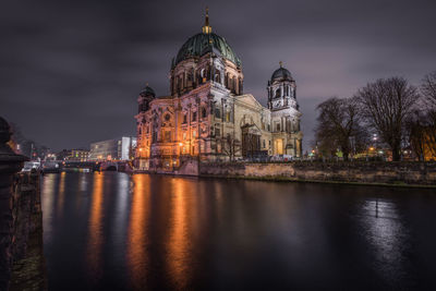 Illuminated cathedral against sky at night