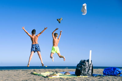 Brothers enjoying at beach