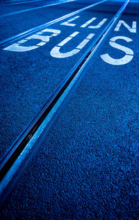 High angle view of arrow sign on road