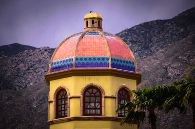 Multi colored dome against mountains