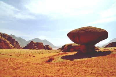 Rock formations in desert against sky