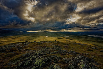 Scenic view of landscape against sky during sunset
