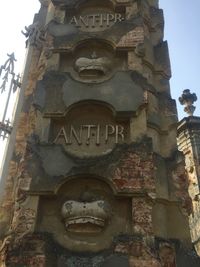 Low angle view of statue against building