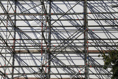 Low angle view of metallic structure against sky