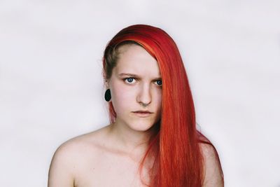 Portrait of a beautiful young woman over white background