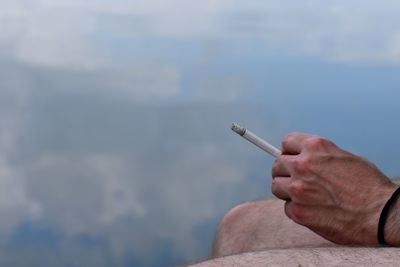 Man holding cigarette