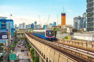 High angle view of railroad tracks amidst buildings in city