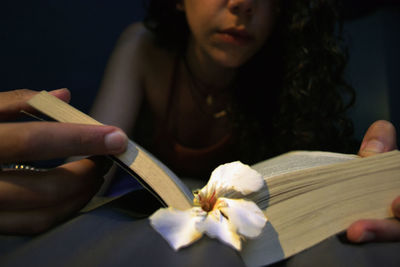 Close-up of woman holding flower